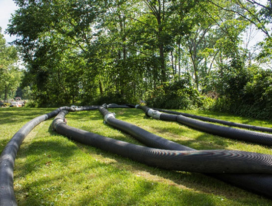 Bypass pumping project using temporary discharge lines to divert flow around an active work area