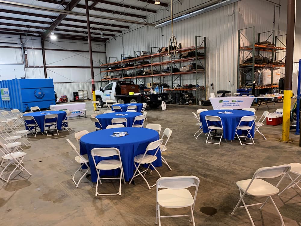 E-Tank facility prepared for a community open house event with tables, chairs, and environmental equipment on display