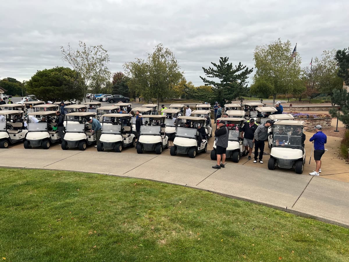 Golfers in golf carts lined up and preparing for the E-Tank Classic charity golf outing, supporting community youth programs while networking with environmental equipment rental professionals.