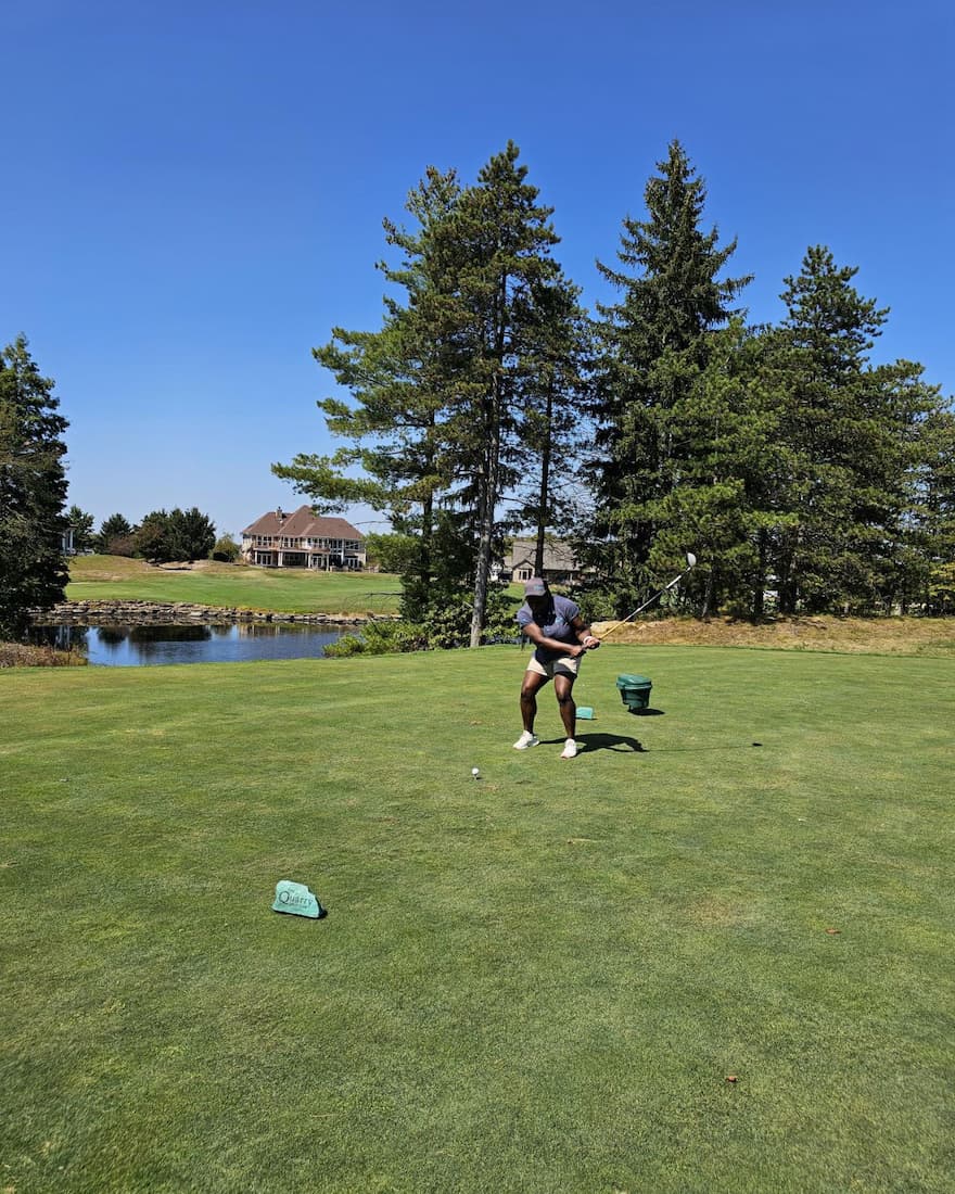 Golfer taking a swing on a clear day at the E-Tank Classic charity golf outing, supporting environmental equipment rental community initiatives.