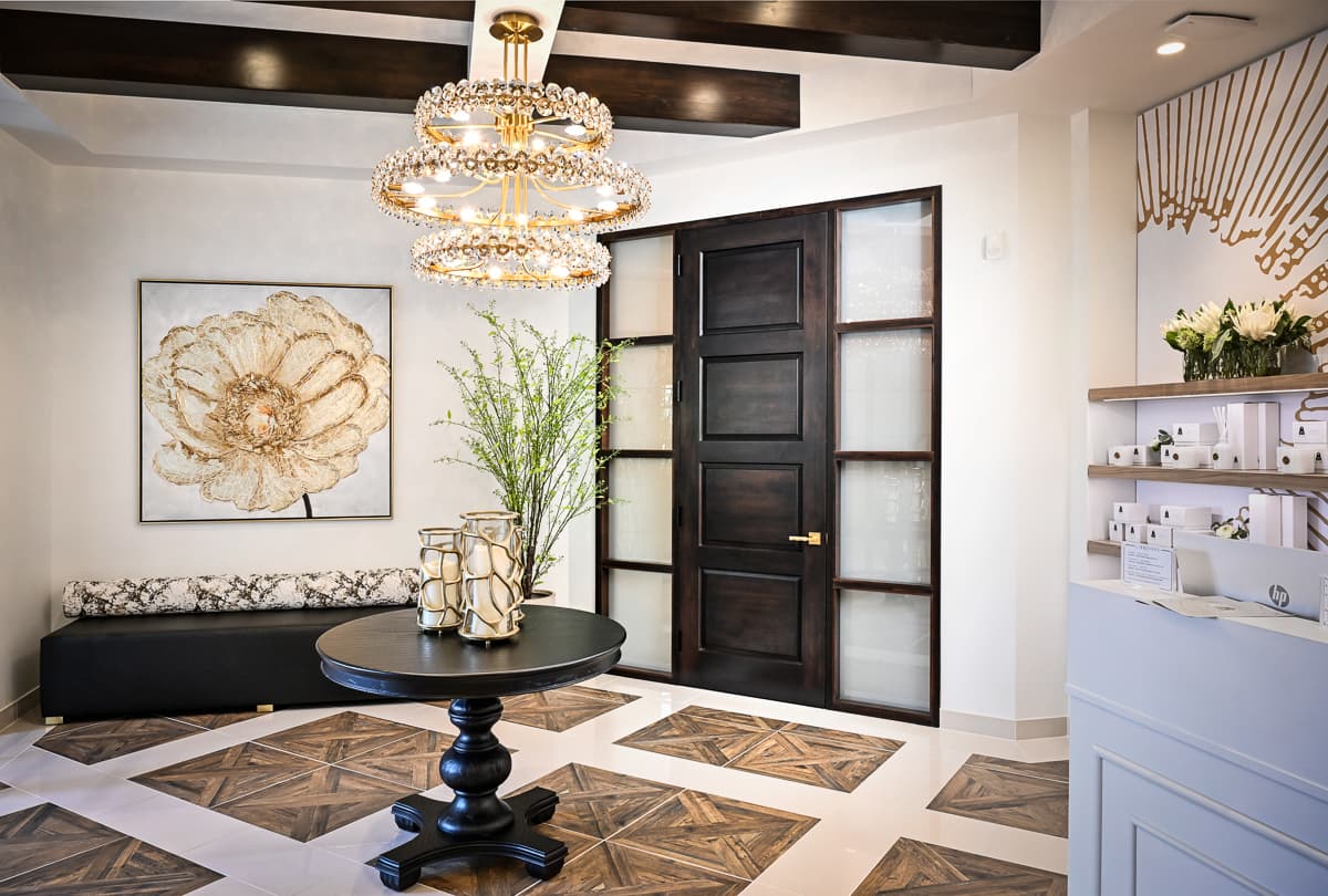 Elegant custom wood door with glass sidelights in Gervasi Spa, Canton, Ohio, crafted by Rockwood Door & Millwork in Millersburg, Ohio.