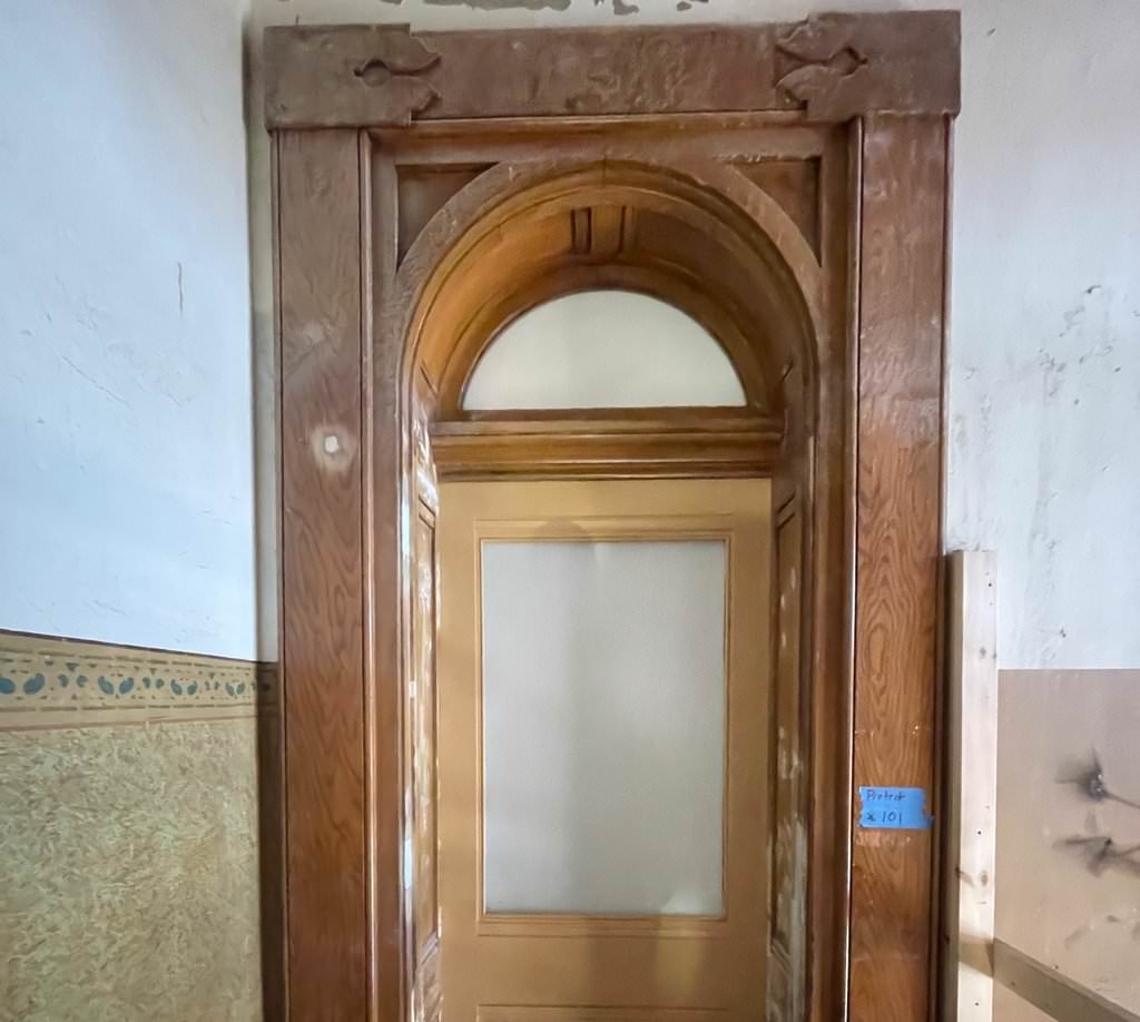 Restored arched wood door at Perry County Courthouse