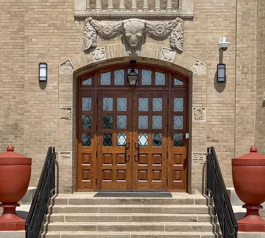 Custom-crafted White Oak entry doors on the historic Metro at Indianola high school.